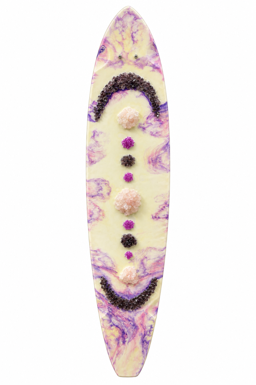 skateboard with white base and pink and purple hues and rose quartz and crushed class